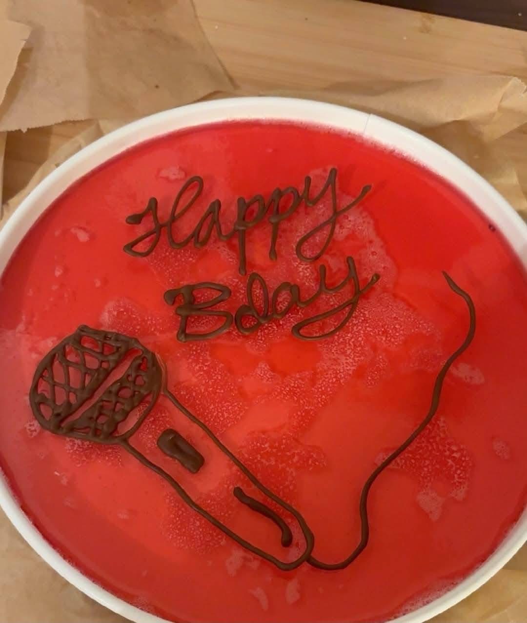 Birthday cake with a microphone for Glasgow Kiss vocalist