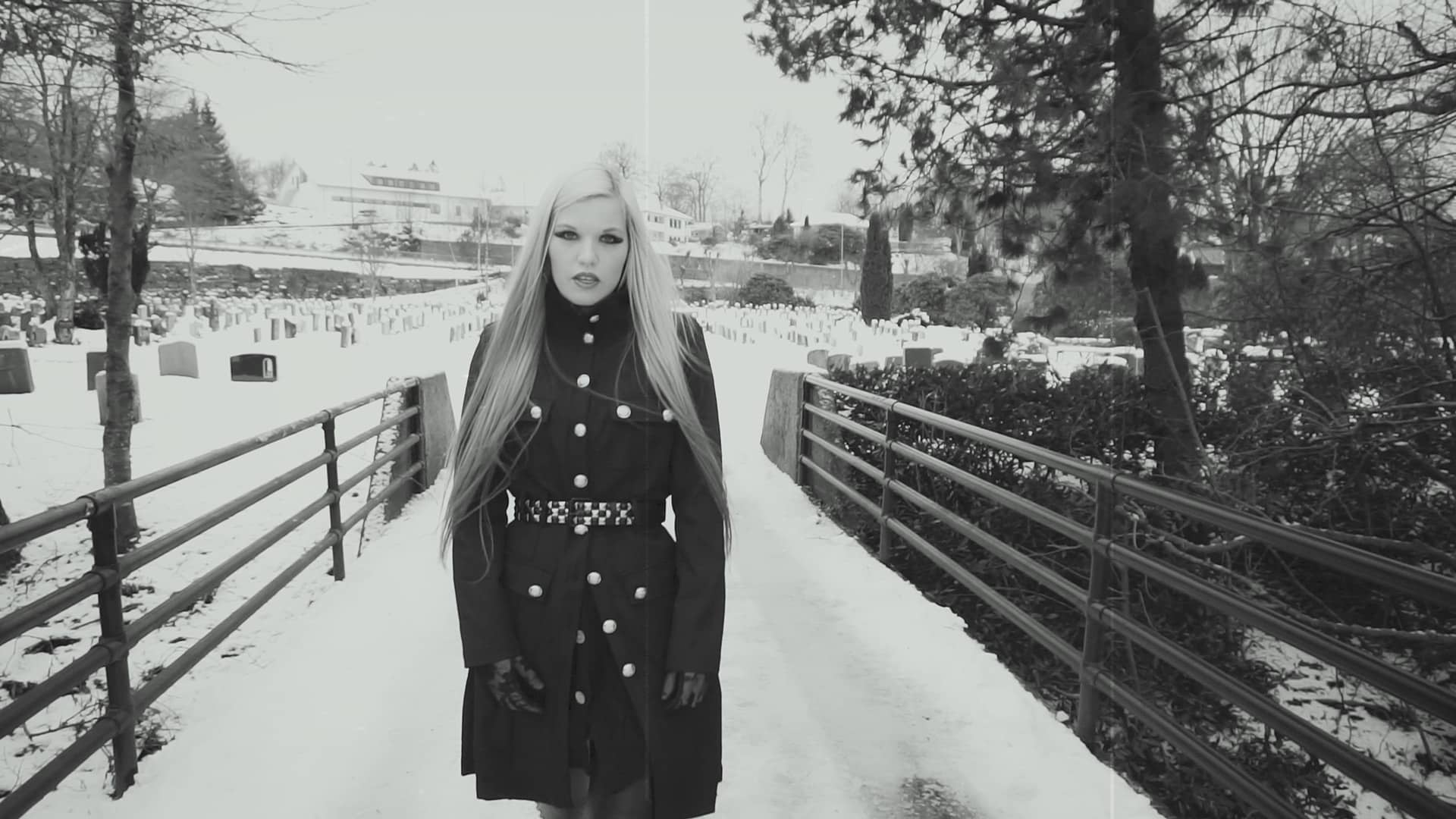 Charlotte alone in the snow — still from the ballad "One Last Time" music video